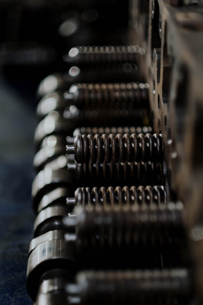 Detailed close-up of metal engine components with focus on camshaft springs.